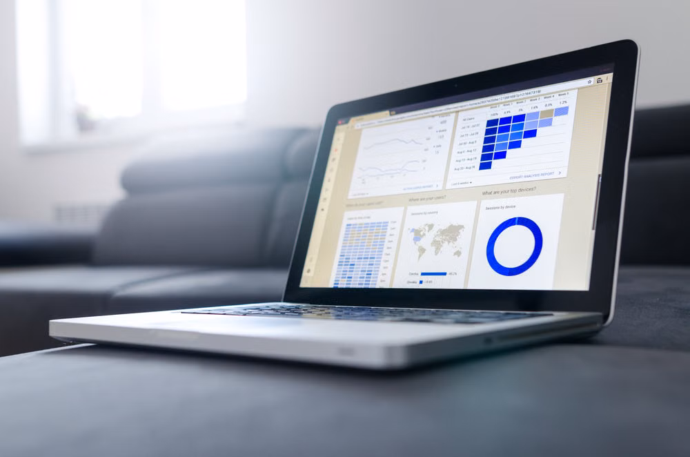 Sleek laptop showcasing data analytics and graphs on the screen in a bright room